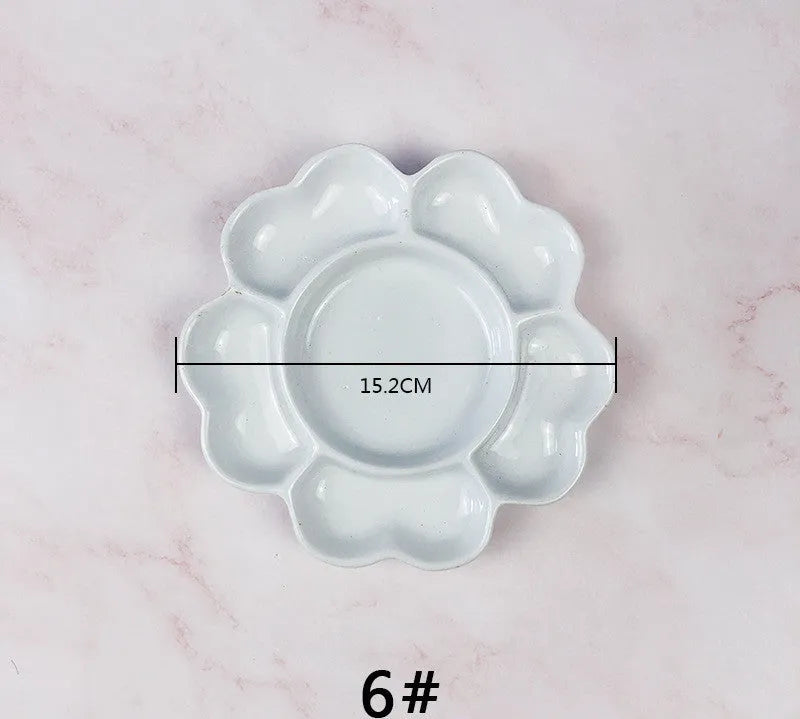 White ceramic painting palette in plum blossom shape for watercolour acrylic oil painting