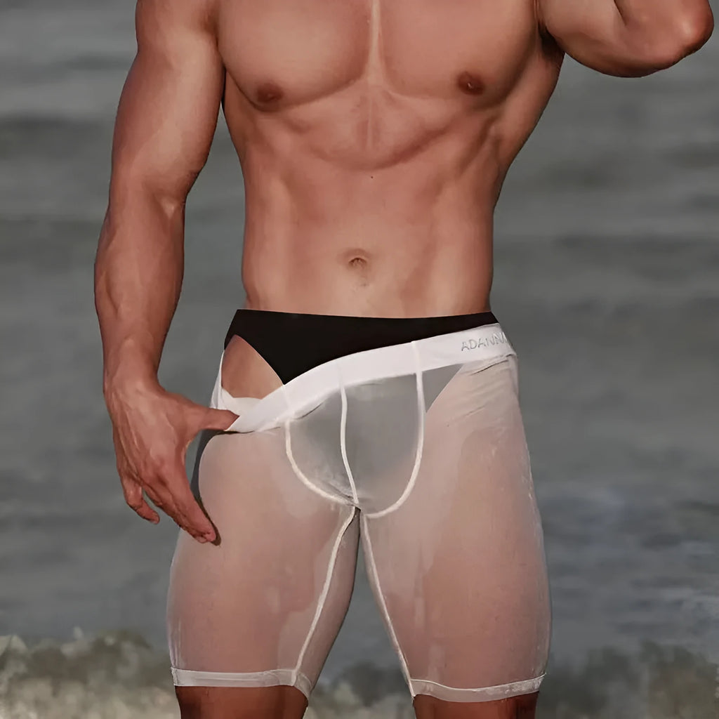 Men's solid colour mesh home shorts in black, showcasing seamless knitted construction and a casual fit.