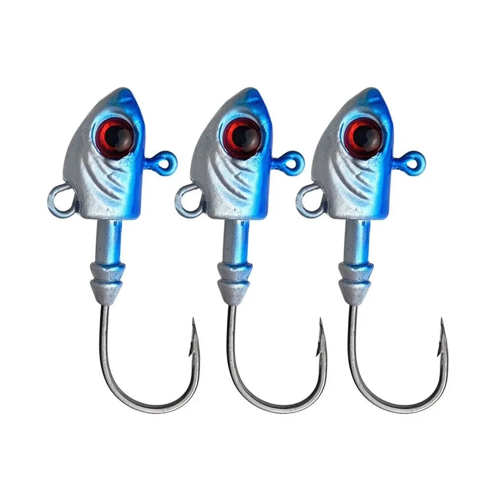 Three yayu shaped lead fishing jig hooks in different weights and colours on a blue background.