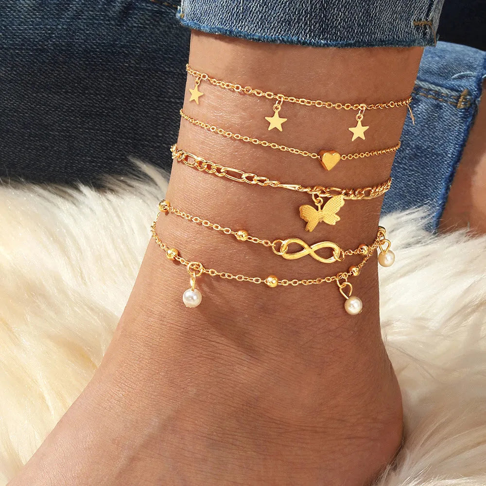 Women's 4-piece anklet set with butterfly, pearl and heart charms in alloy