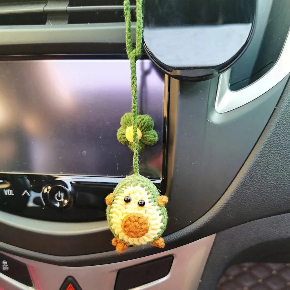 Handmade crocheted wool car pendant with avocado and rainbow design in three colour variations