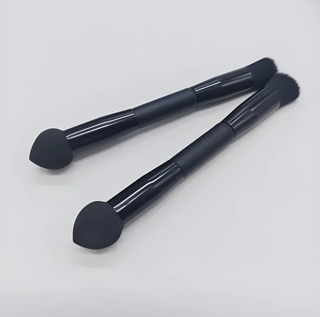 Double-headed makeup brush with black sponge end and pointed brush end on wooden handle