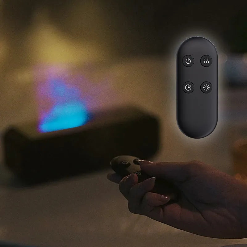 Black and white aroma diffuser with colour-changing LEDs, remote control, and USB cable.