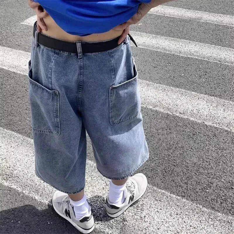 Blue washed denim men's pirate shorts with a high waist and straight legs on a white background.