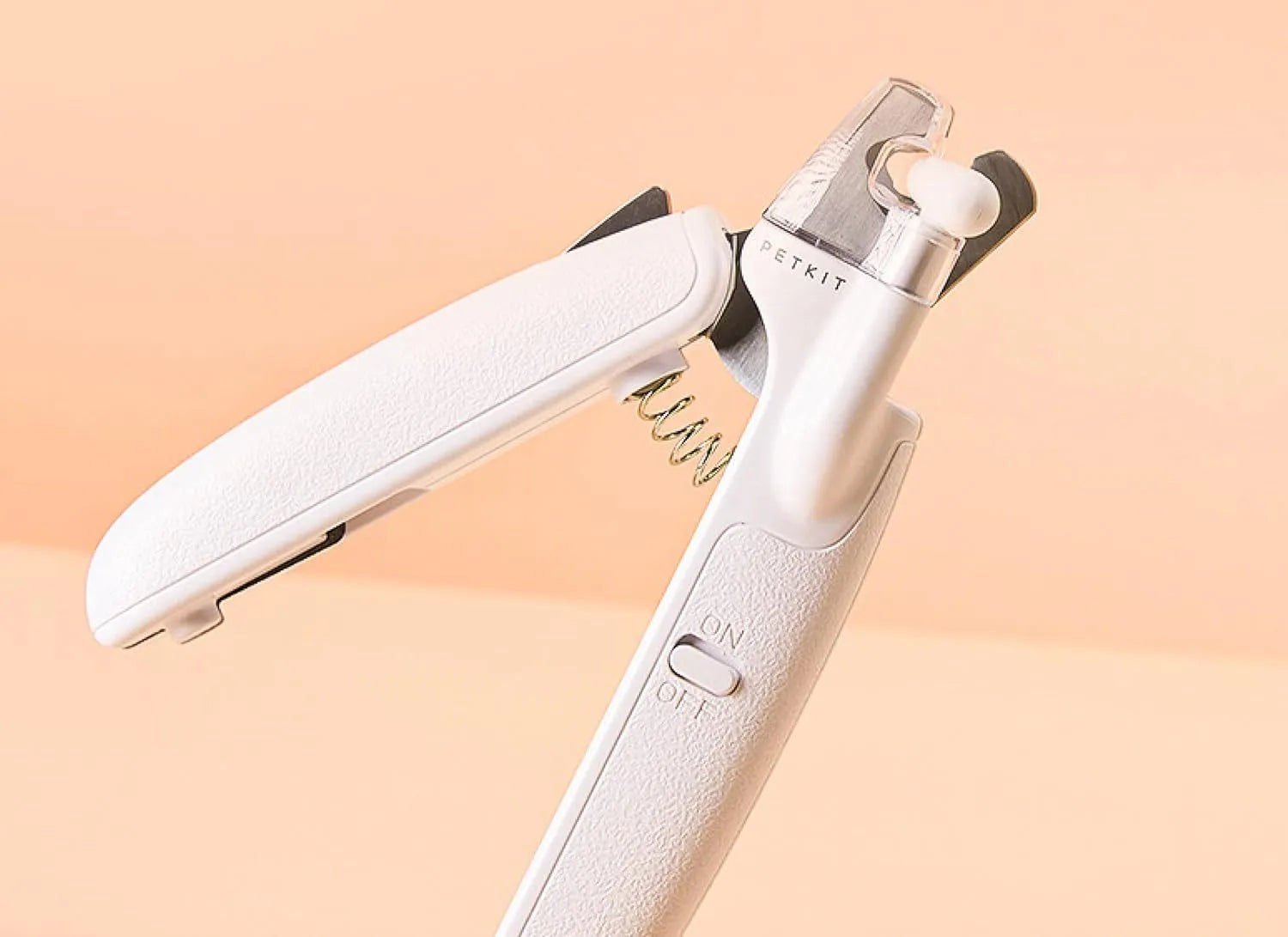 White pet nail clippers with LED light, anti-splash guard, and leather-like handle.