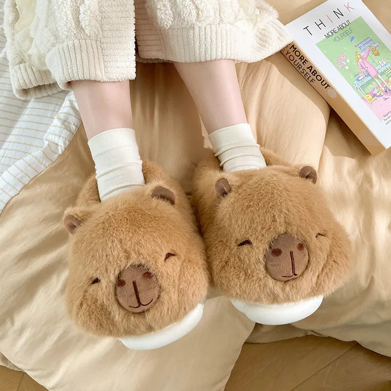 Light brown women's winter slippers with plush cotton upper and cartoon pattern.
