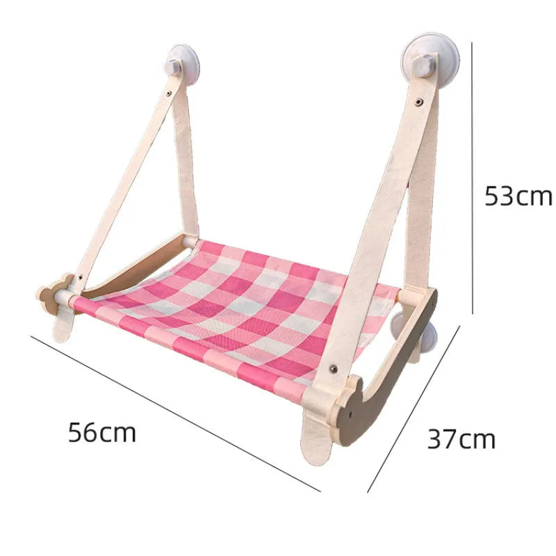 Wooden frame cat window hammock bed with linen fabric attached by suction cups to a window.