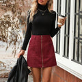 Women's high waist short skirt with front zipper and stitching detail in black colour