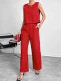 Red polyester two-piece set with sleeveless top and wide leg trousers