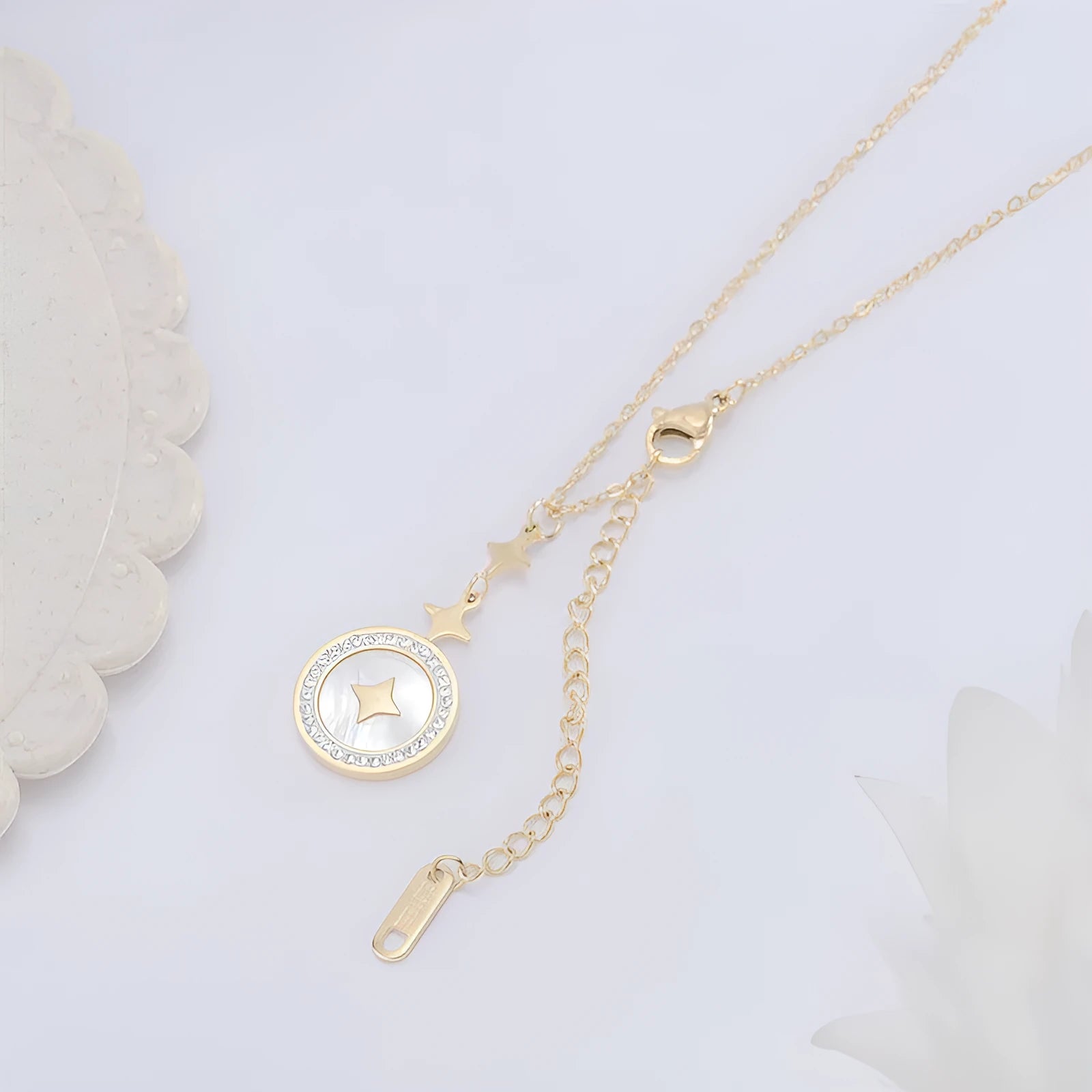 Gold titanium steel necklace with a geometric six-pointed star pendant on a chain.