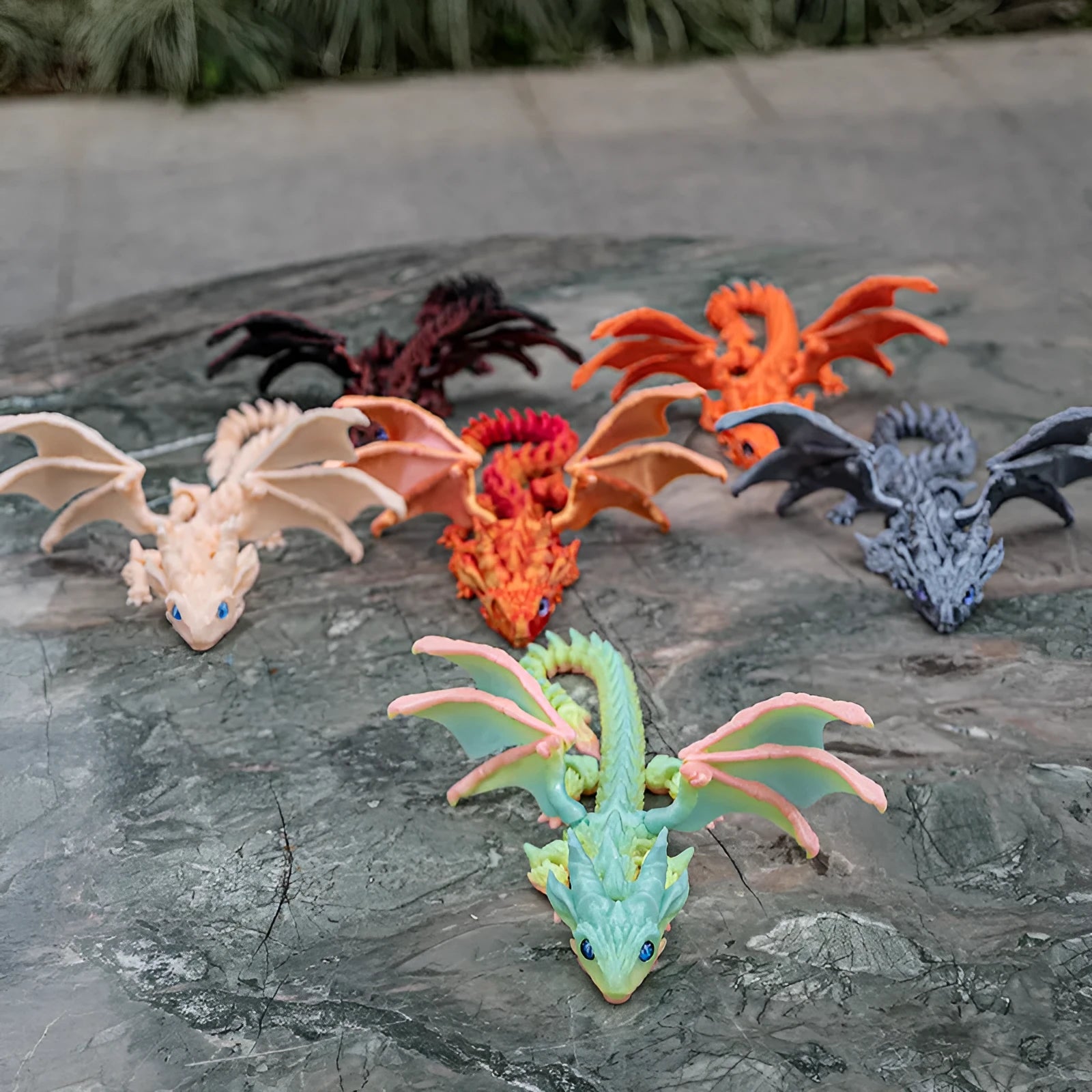 Red and gold printed dragon wings decorative toy made of PLA plastic.