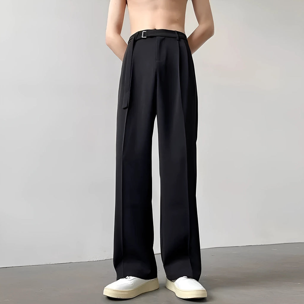 Women's black wide leg straight cut trousers with a non-iron finish on a neutral background