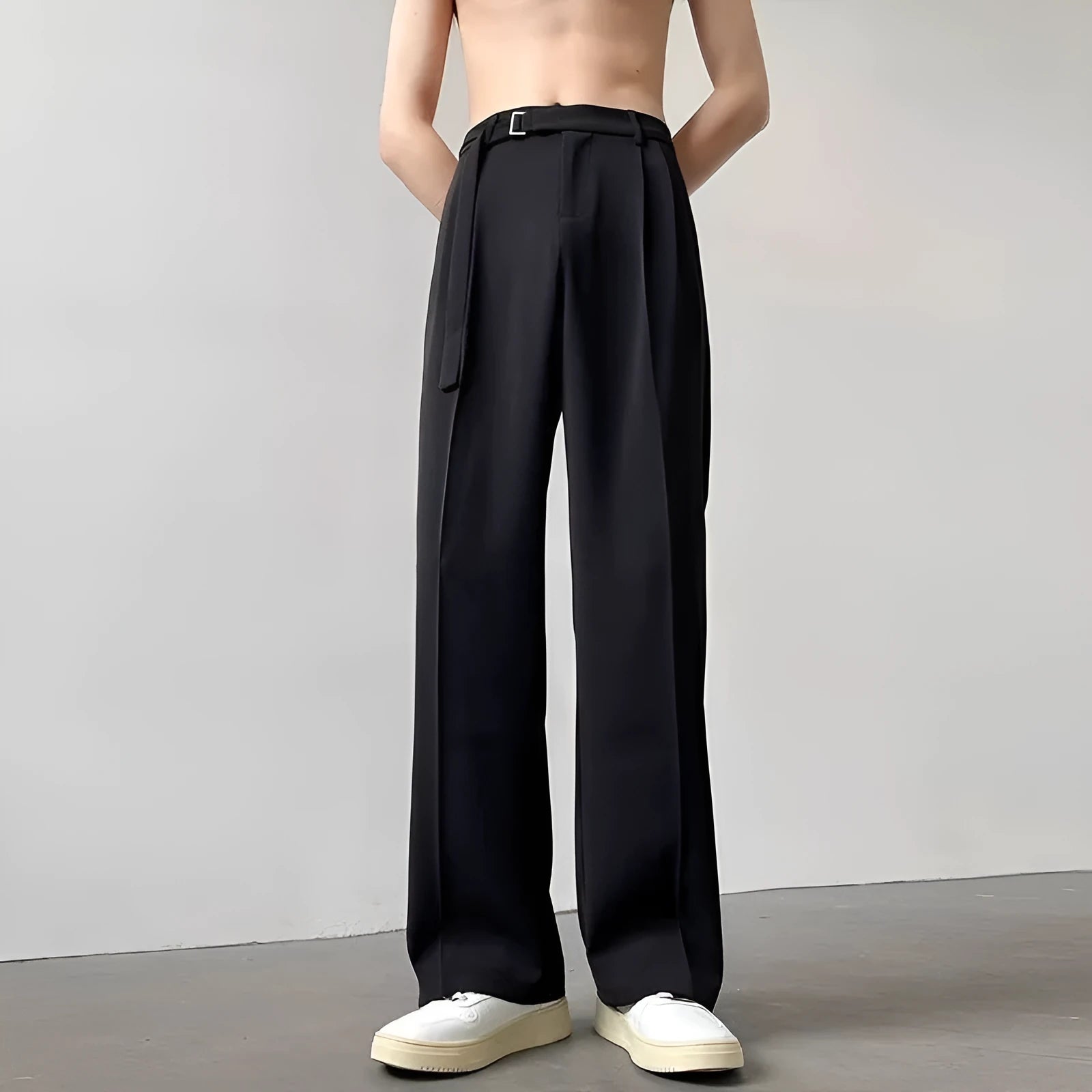 Women's black wide leg straight cut trousers with a non-iron finish on a neutral background
