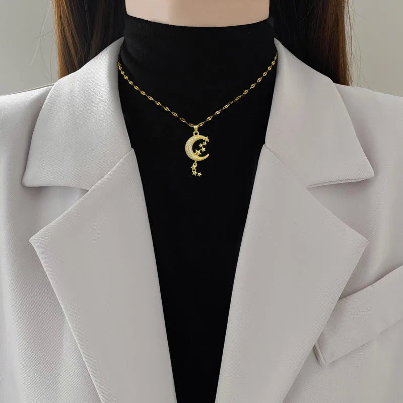 Full diamond necklace with geometric moon tassel pendant in stainless steel and copper construction
