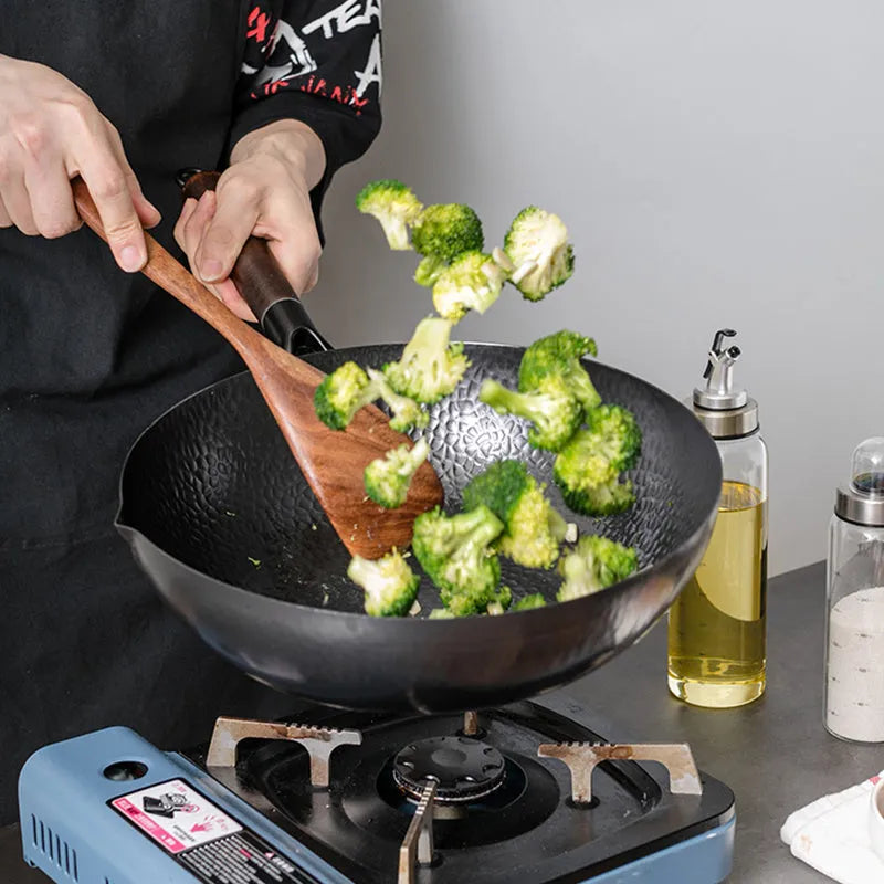 Traditional handmade iron wok pan with wooden handle and black finish, 40cm diameter