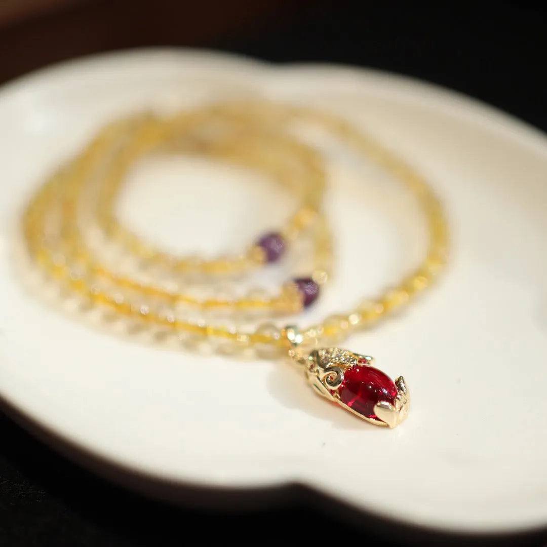 Natural Brazilian gold rutilated quartz bracelet with three-circle gold and ruby quartz design