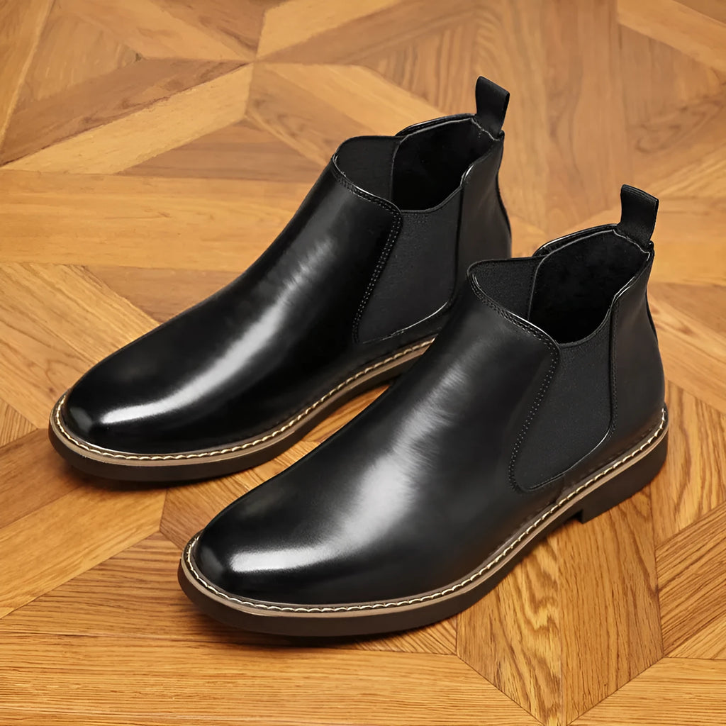Men's black formal leather boots with pointed toe design and lace-up ankle