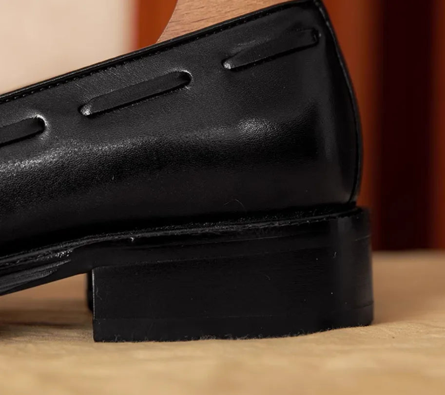 Men's black genuine leather slip-on loafers with fringed detailing and rubber sole