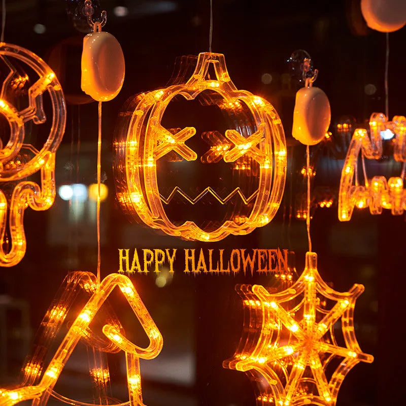 Halloween window hanging LED lights with spider pumpkin ghost designs and suction cup attachment