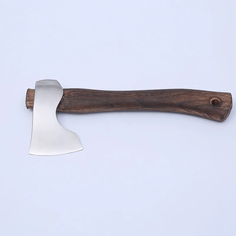 Camping axe with wooden handle and high carbon steel blade on a neutral background.