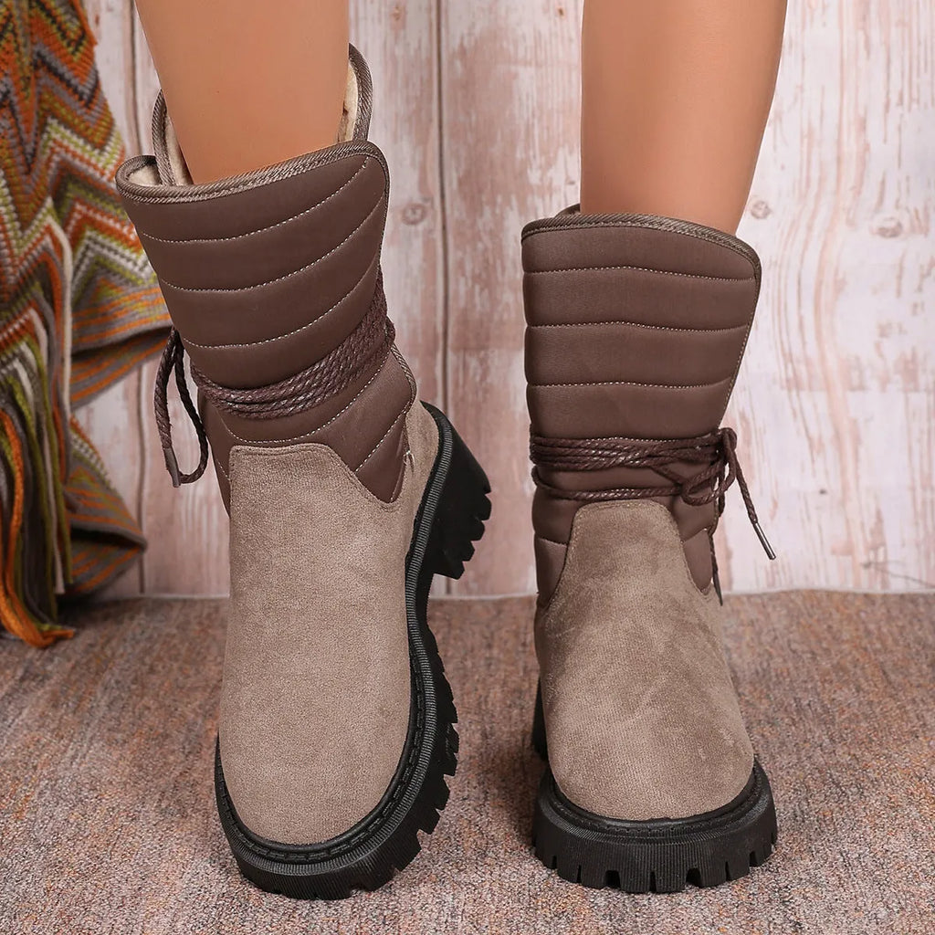 Women's chunky heel snow boots in black with suede upper and lace-up design