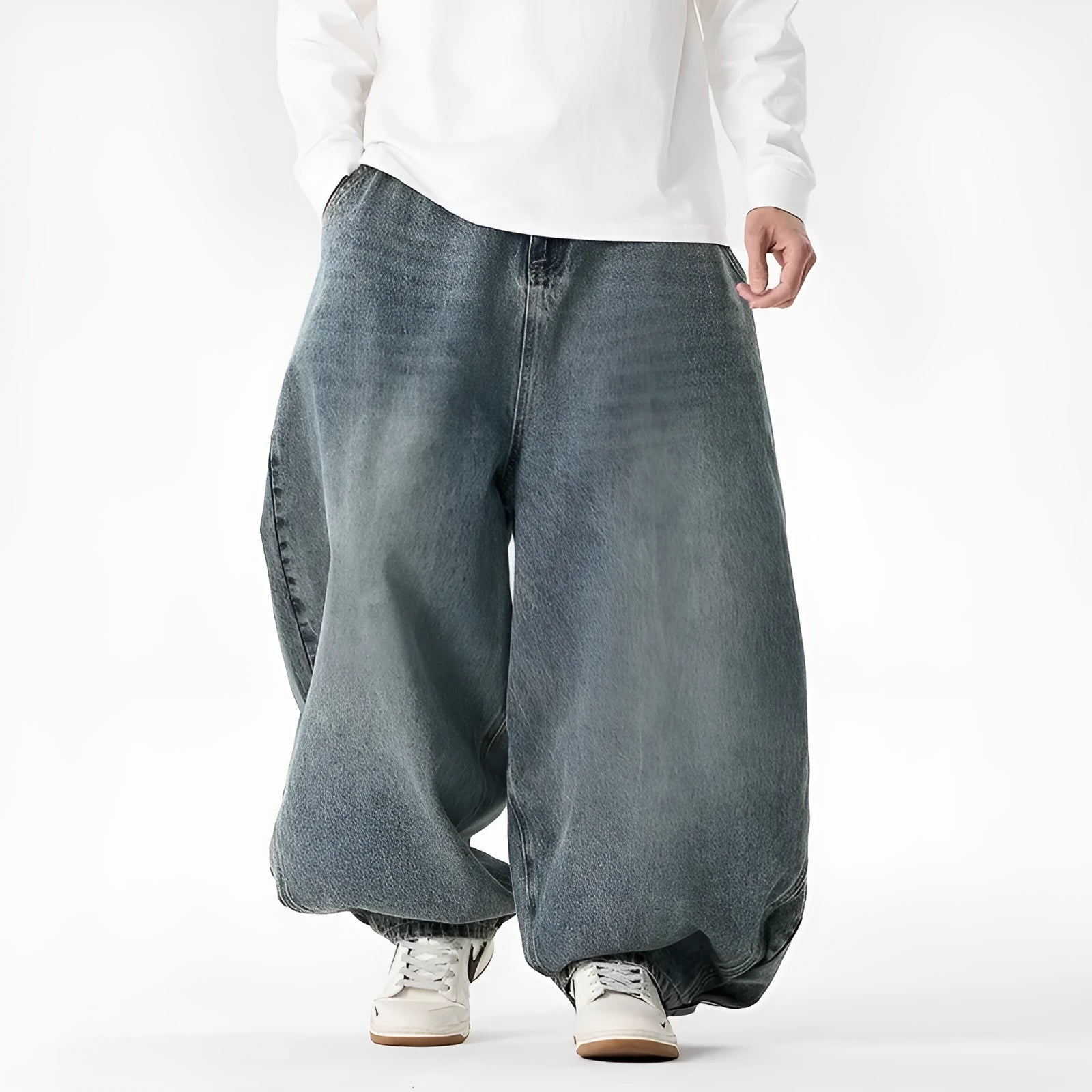 Man wearing black plus-size baggy denim jeans with a straight leg and low waist.