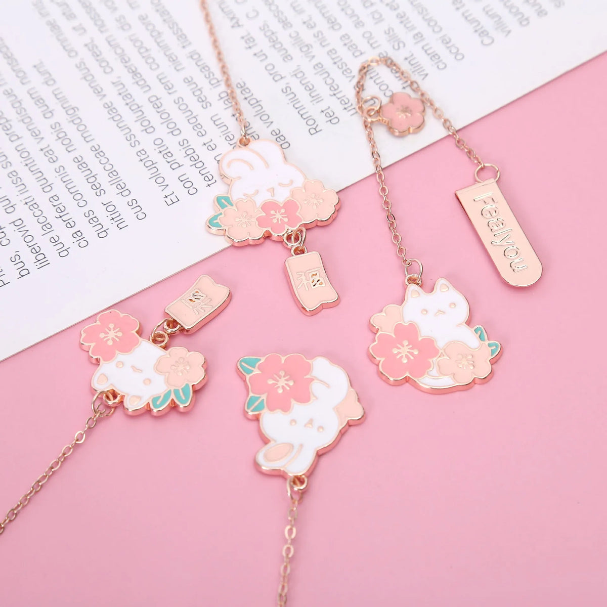Cute cartoon metal bookmark pendant featuring a cherry cat or sakura rabbit design with sakura blossoms or a fu character.