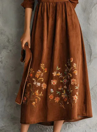 Brown vintage-style midi dress with floral embroidery and suede texture