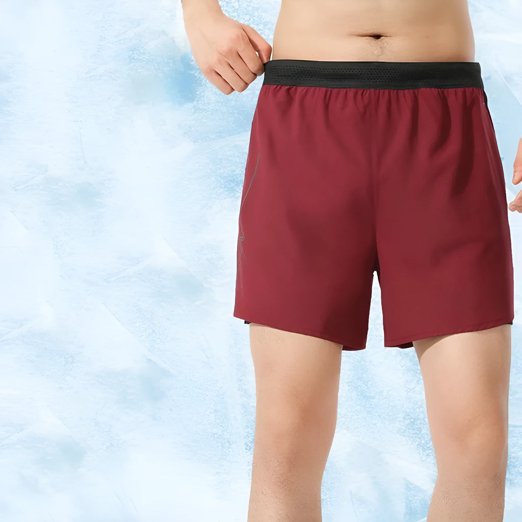 Men's black polyester basketball shorts with low-waist elasticated waistband laid flat