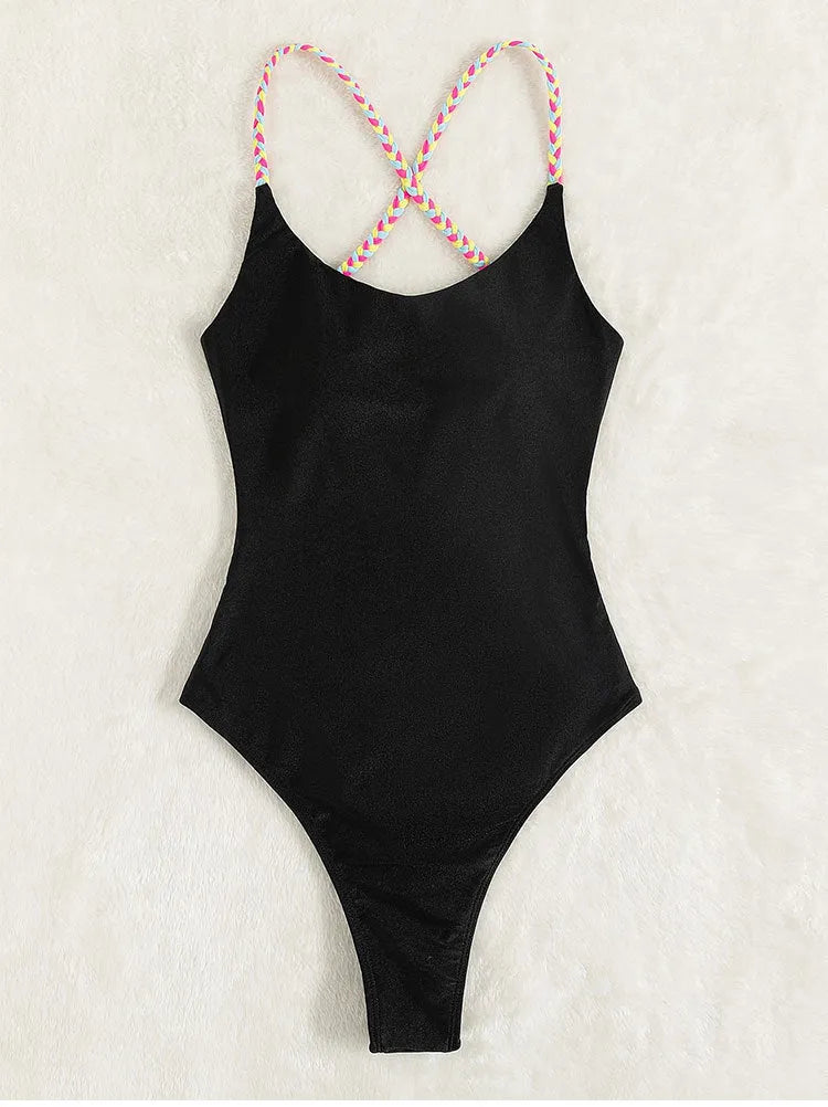 Black solid colour one-piece swimsuit for women with a backless design and sleeveless cut.