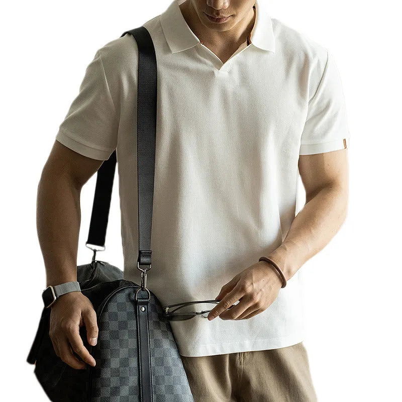 American-style cotton blend short-sleeved polo shirt in blue, shown in a regular fit for casual summer wear.