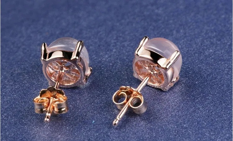 Women's rose gold drop shape stud earrings with synthetic ross quartz detailing and Korean style design