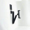 Universal alloy wall rack for tablet and large mobile phone, shown as a wall hanging bracket for home or office use