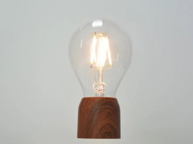 Magnetic levitation floating bulb on imitation wood base with glass enclosure and ABS construction