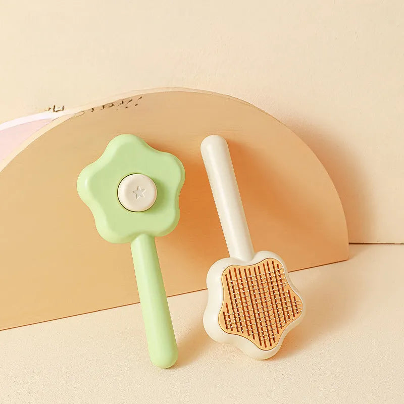 Self-cleaning pet grooming comb with stainless steel needles showing green colour option