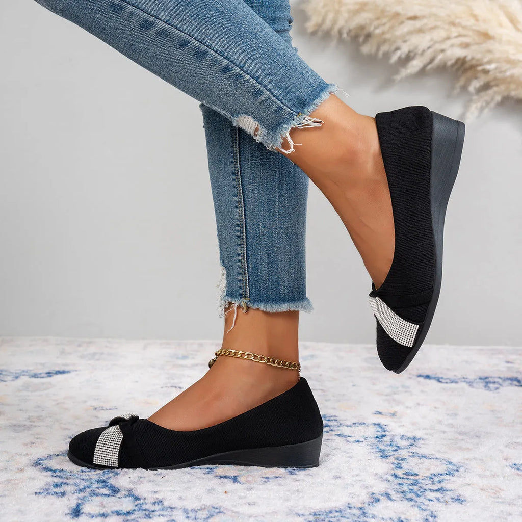 Black women's slip-on casual shoes with rhinestone decoration and a chunky heel.
