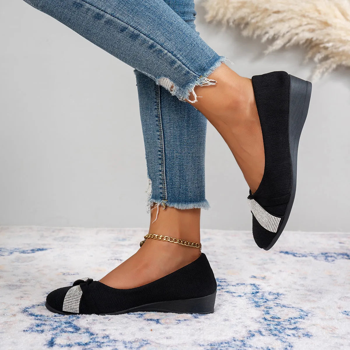 Black women's slip-on casual shoes with rhinestone decoration and a chunky heel.