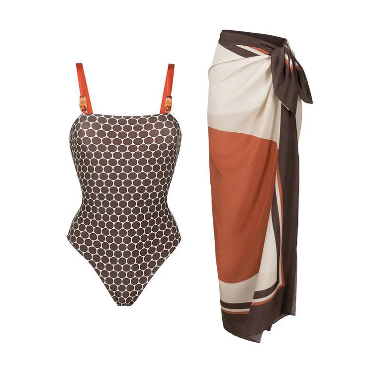 Dot printed one-piece swimsuit with matching wrap skirt in polyester fabric