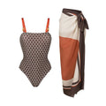 Dot printed one-piece swimsuit with matching wrap skirt in polyester fabric