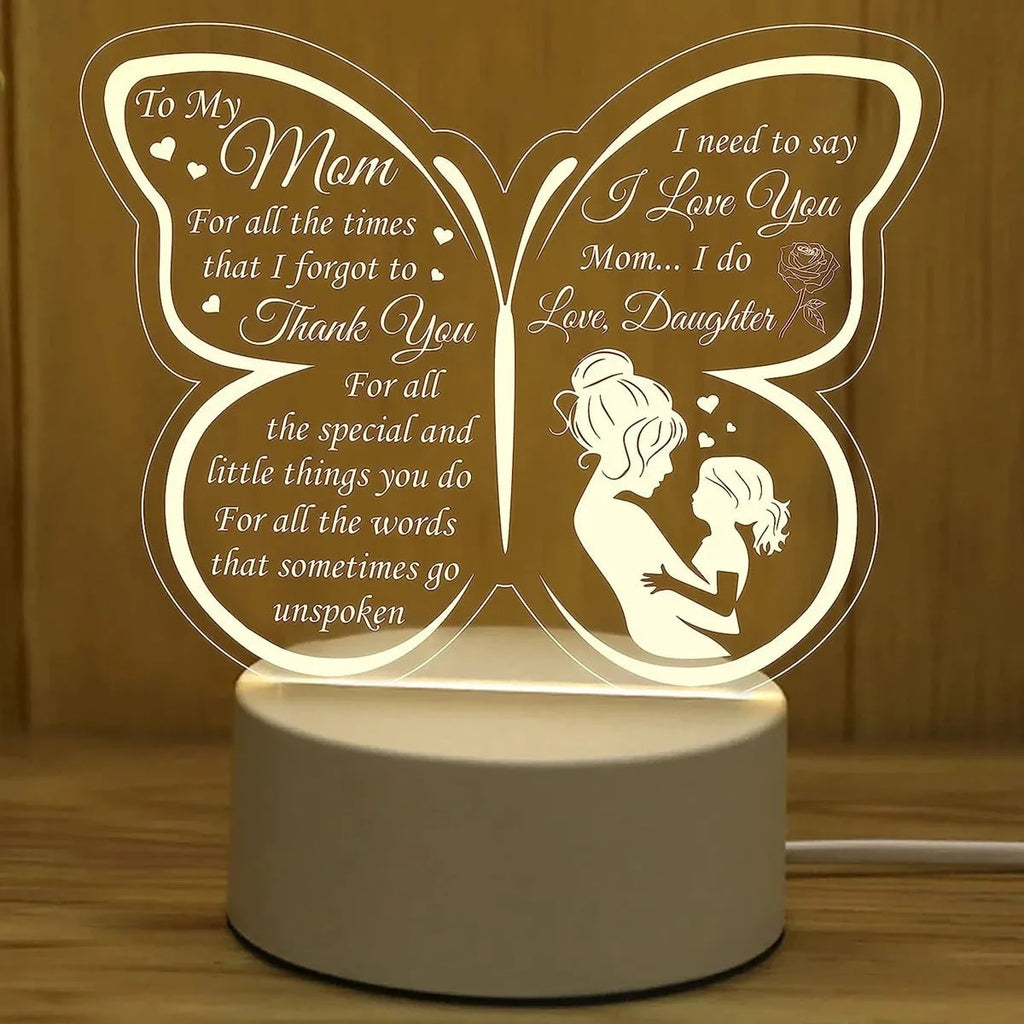 White heart-shaped acrylic table lamp with touch switch on a wooden surface