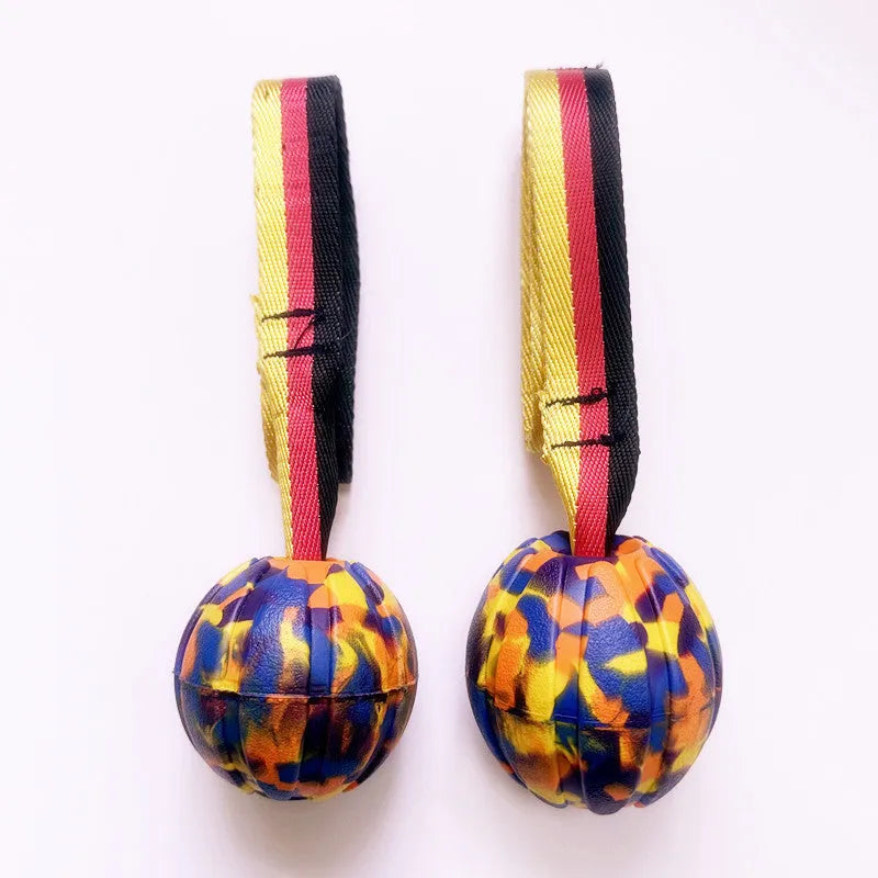 Floating water bite-resistant pet training ball in camouflage and yellow colours showing three size options