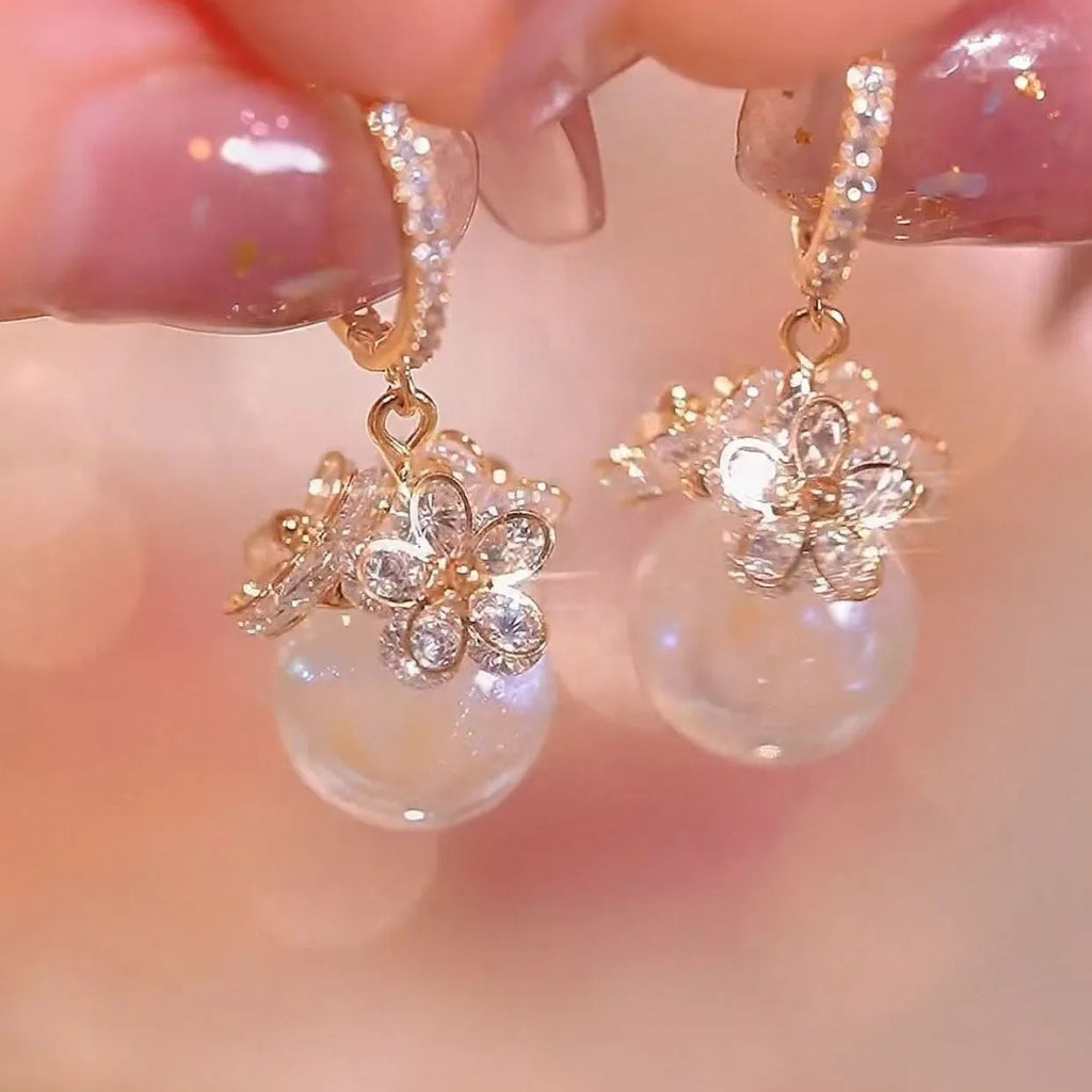 Geometric rose design copper earrings with zircon stones in an electroplated colour finish.