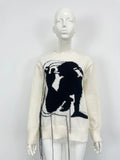 Women's loose alpaca wool sweater with abstract pattern and tassel detailing in street fashion style