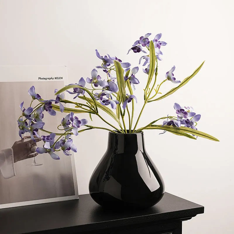 Ceramic round belly French vase with orchid flowers in black or white colour options
