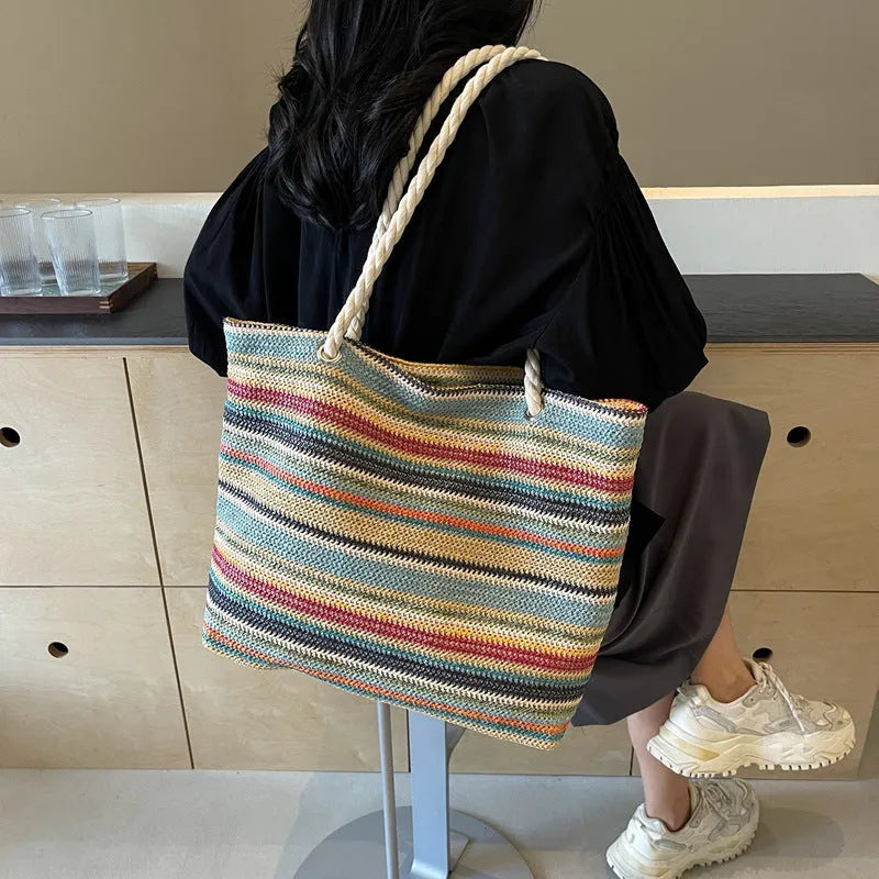 Blue straw woven shoulder bag with nylon construction and polyester lining