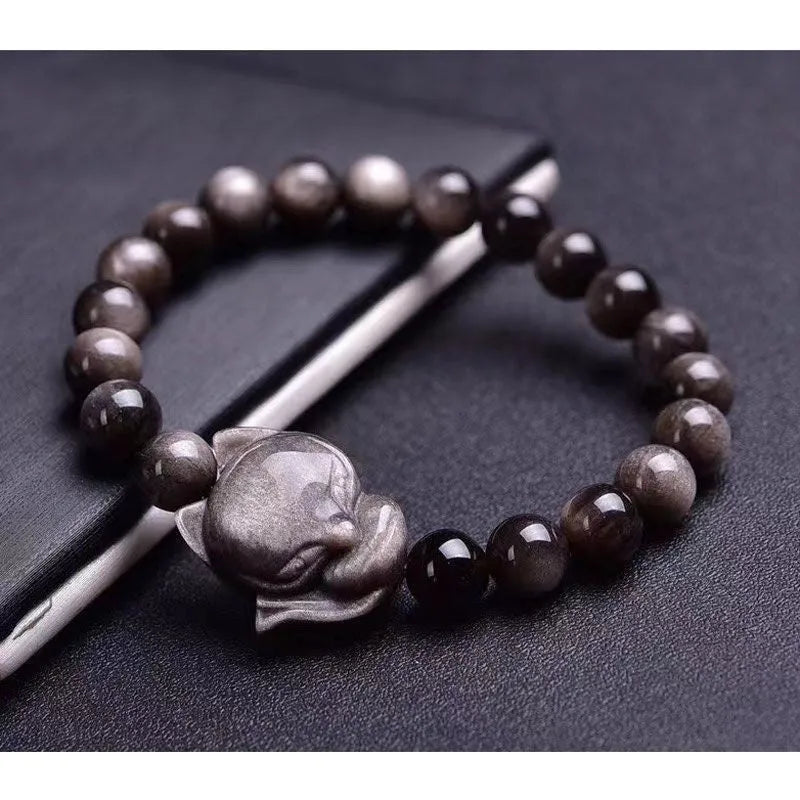 Black obsidian bracelet with fox design featuring 8mm polished stones and adjustable closure