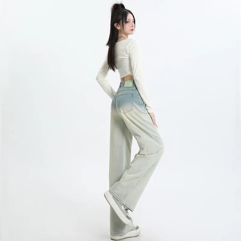 Women's gradient blue straight-leg denim trousers with wide-leg style on hanger