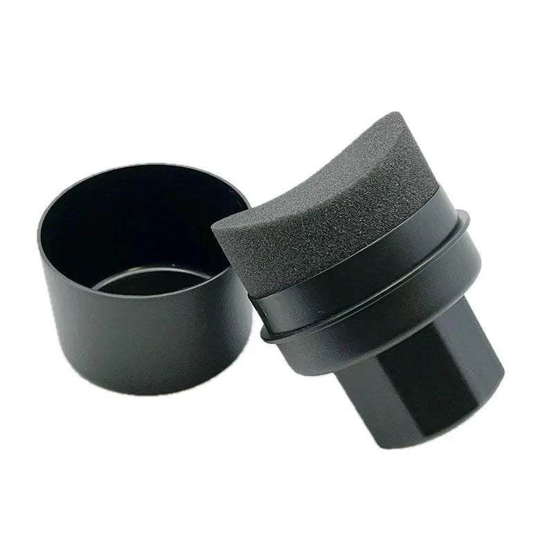 Black and red tire polishing sponge brushes with PP handles and lids on a garage workbench.