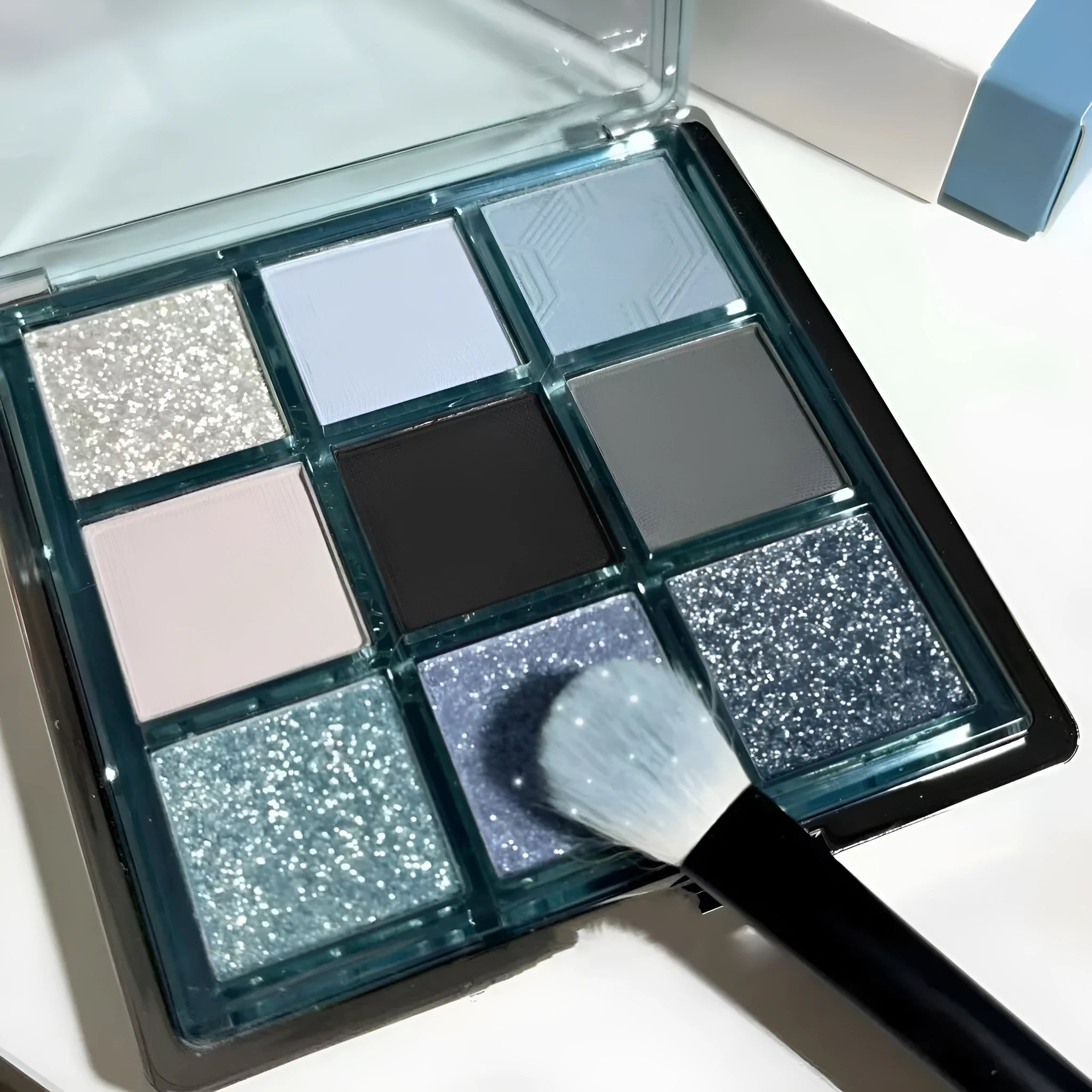 MUGELEEN 08 nine-colour eye shadow palette showing low saturation blue smoked and earth tones