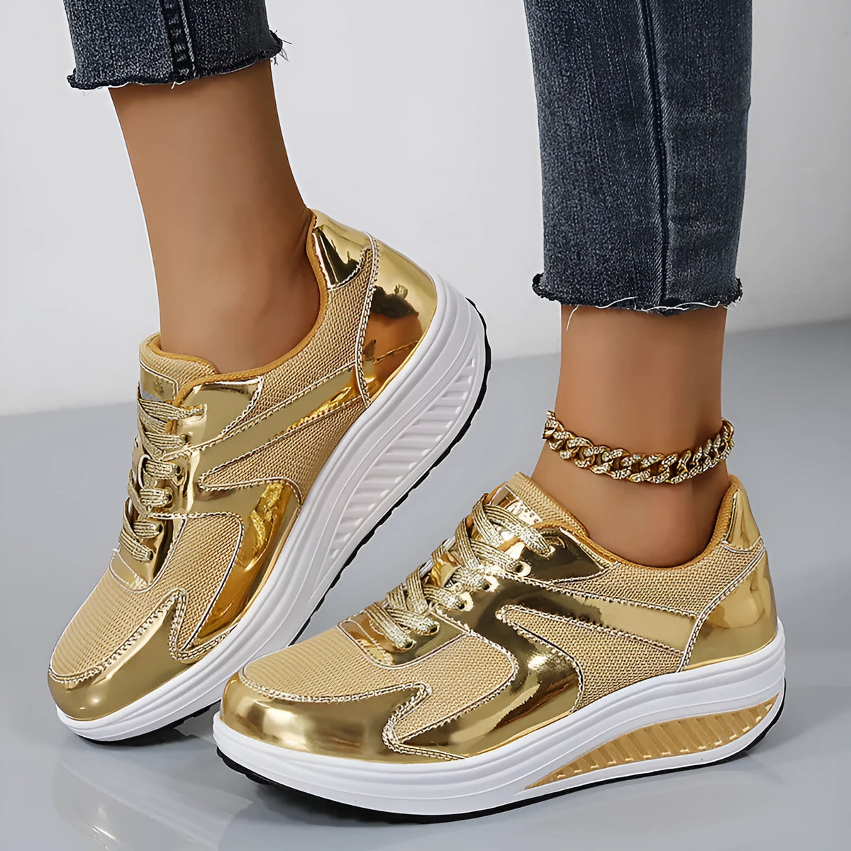 Women's gold platform casual shoes with mesh upper and cross strap design showing 3-5cm heel height
